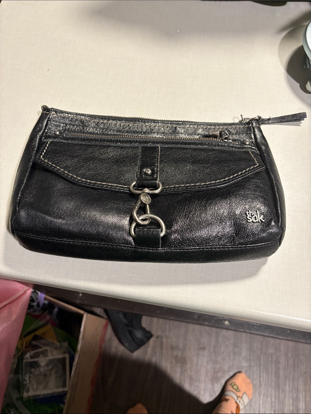 The Sak Black Leather Wristlet Clutch with Silver Hardware